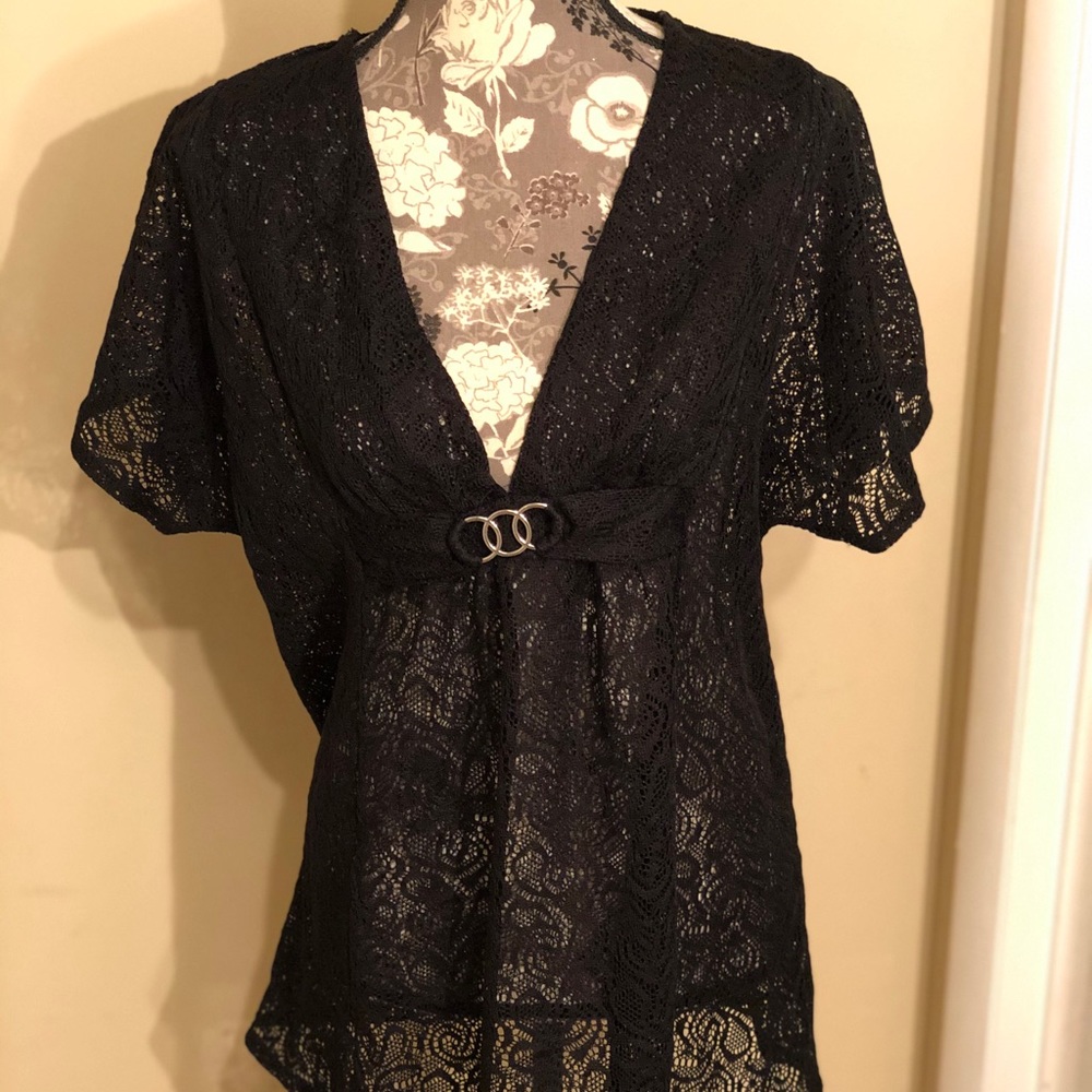 Jaclyn Smith black swim cover up.